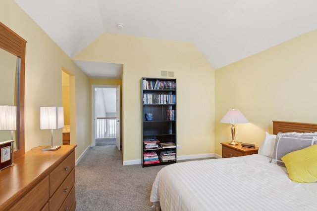 carpeted bedroom featuring lofted ceiling