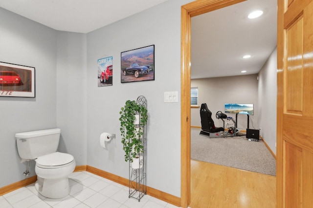 bathroom with tile patterned floors and toilet