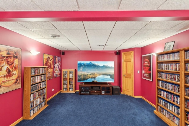 home theater with a drop ceiling and dark colored carpet