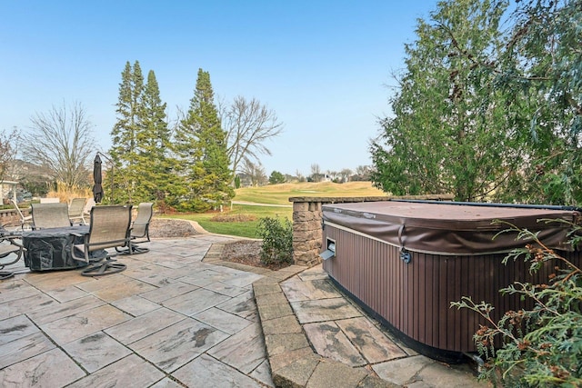 view of patio / terrace featuring a hot tub