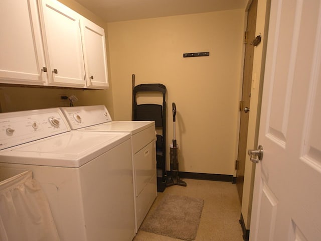 laundry area with cabinets and separate washer and dryer