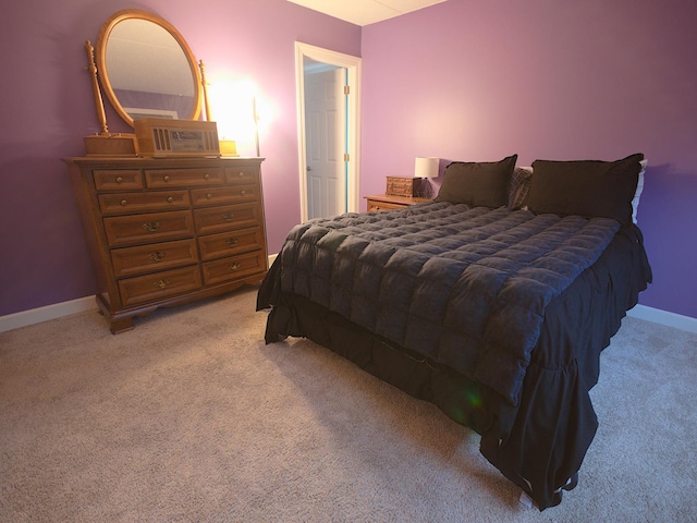 bedroom with light colored carpet