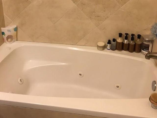 bathroom featuring a tub to relax in