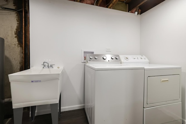 clothes washing area featuring sink and washing machine and clothes dryer