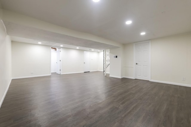 basement with dark wood-type flooring