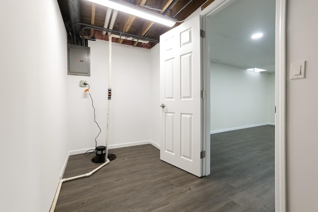 washroom featuring electric panel and dark hardwood / wood-style floors