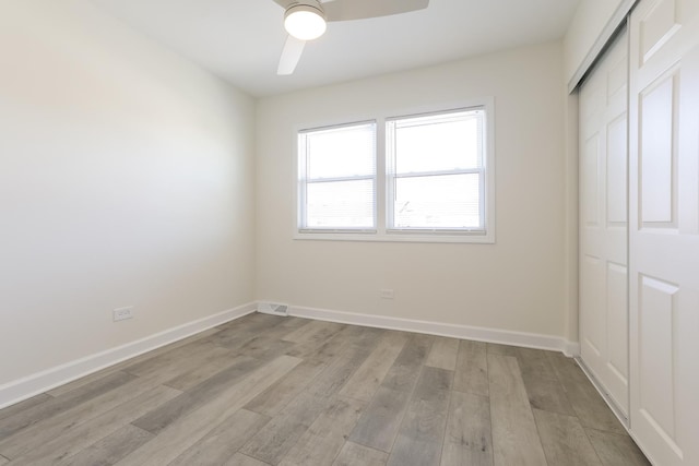 interior space with ceiling fan and light hardwood / wood-style flooring