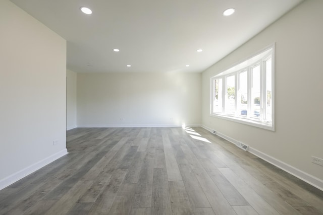 empty room featuring dark wood-type flooring