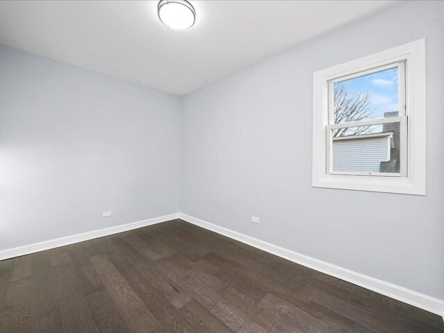 spare room with hardwood / wood-style flooring