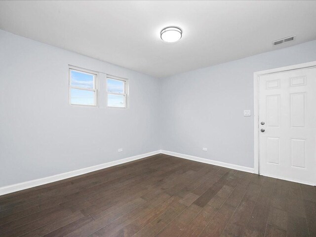 empty room featuring dark hardwood / wood-style floors