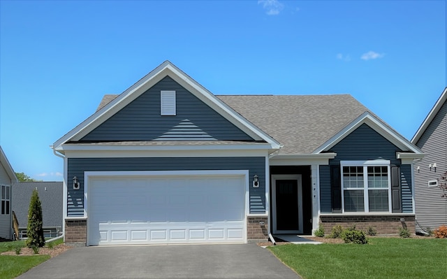 craftsman-style house with a front lawn and a garage