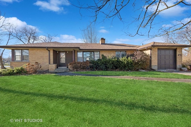 single story home featuring a front yard and a garage