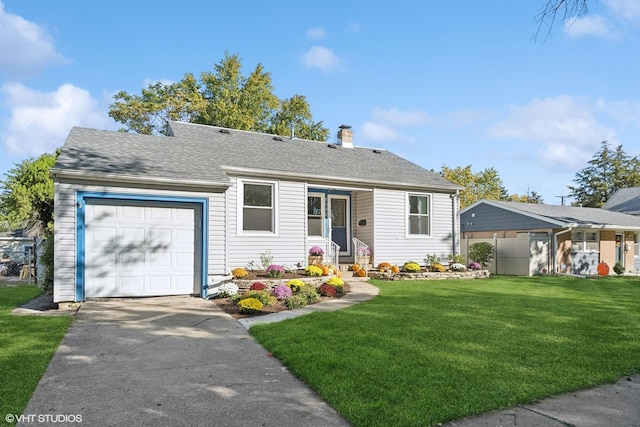 view of front of property with a front lawn and a garage