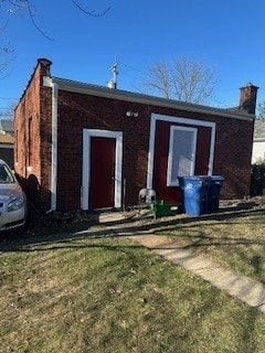 back of property with a yard