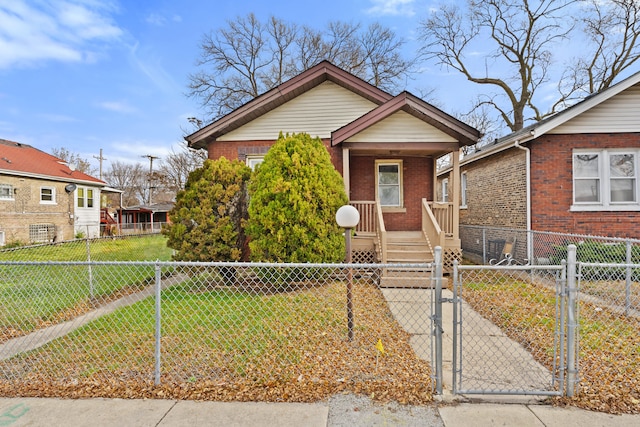 bungalow-style house featuring a front lawn