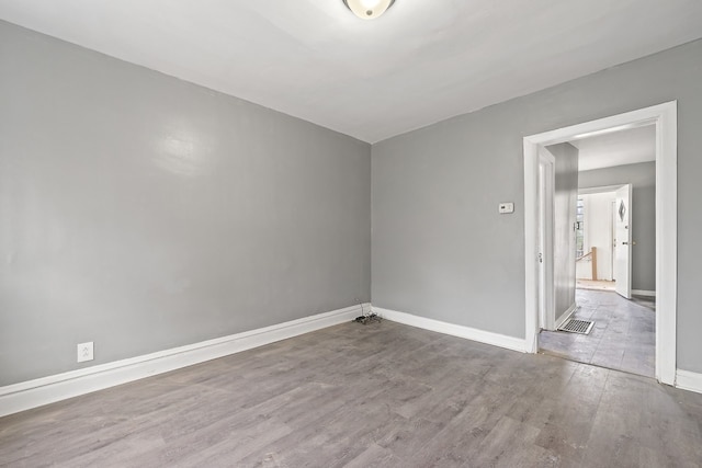 empty room featuring hardwood / wood-style flooring