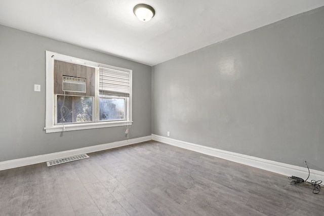 unfurnished room featuring wood-type flooring