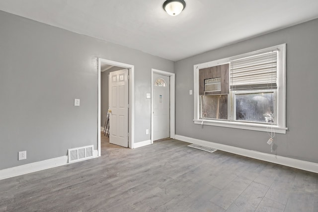 unfurnished room with light hardwood / wood-style floors