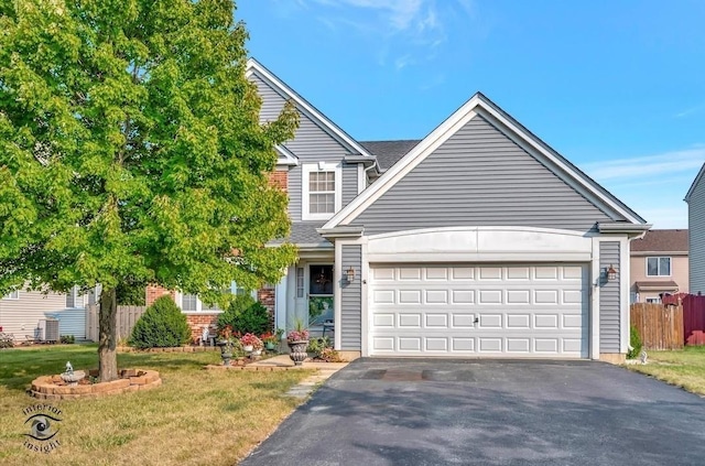 view of front of house featuring a garage and a front lawn