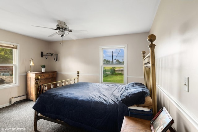 bedroom with a baseboard heating unit, carpet, and a ceiling fan