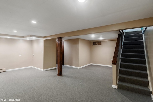 finished basement featuring stairway, recessed lighting, baseboards, and dark colored carpet