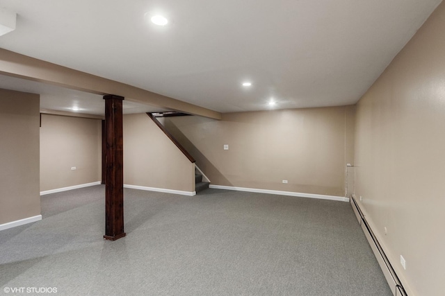 finished basement featuring recessed lighting, a baseboard radiator, and baseboards