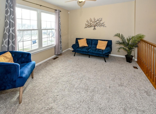 sitting room with carpet flooring and ceiling fan