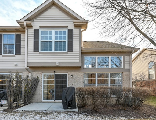 rear view of property featuring a patio