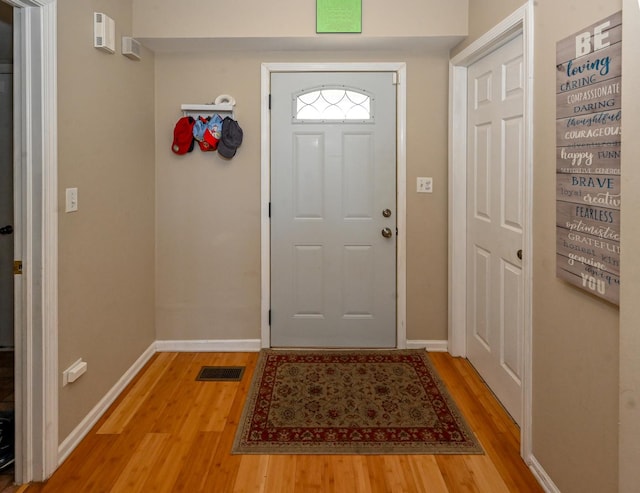 entrance foyer featuring wood-type flooring