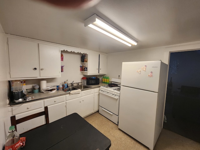 kitchen with white cabinets, white appliances, and sink