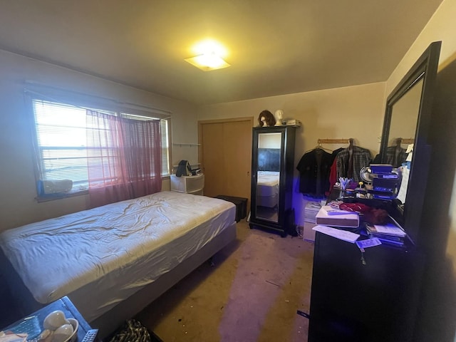 bedroom with carpet flooring and a closet