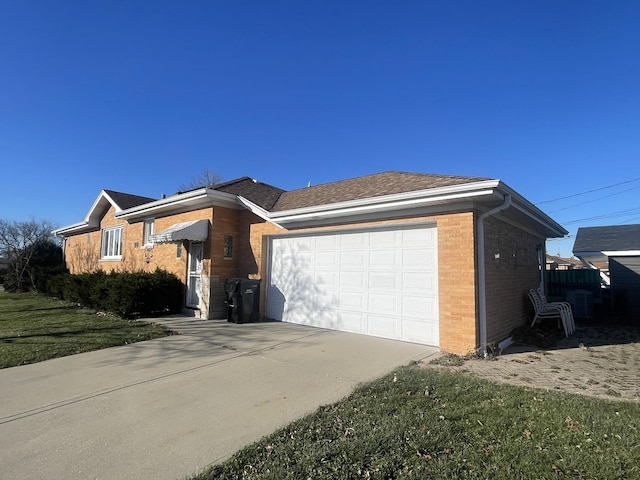 single story home with a garage and a front yard