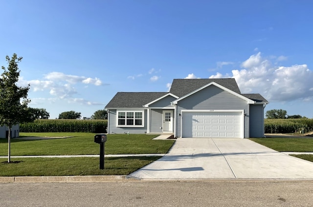 view of front facade featuring a front yard and a garage