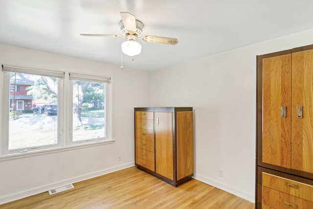 unfurnished bedroom featuring ceiling fan and light wood-type flooring