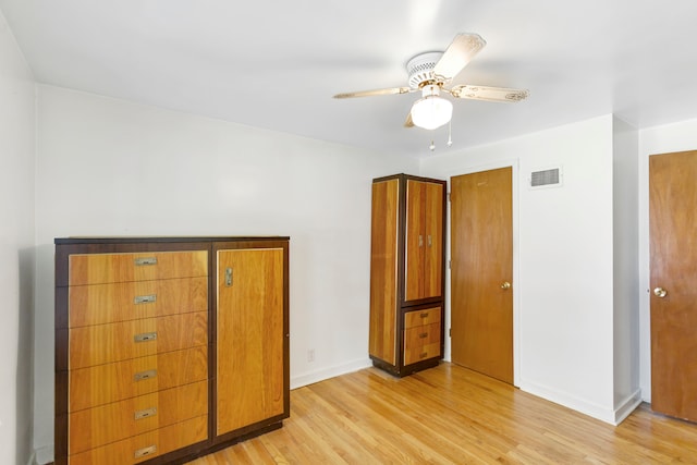 unfurnished bedroom featuring light wood-type flooring and ceiling fan