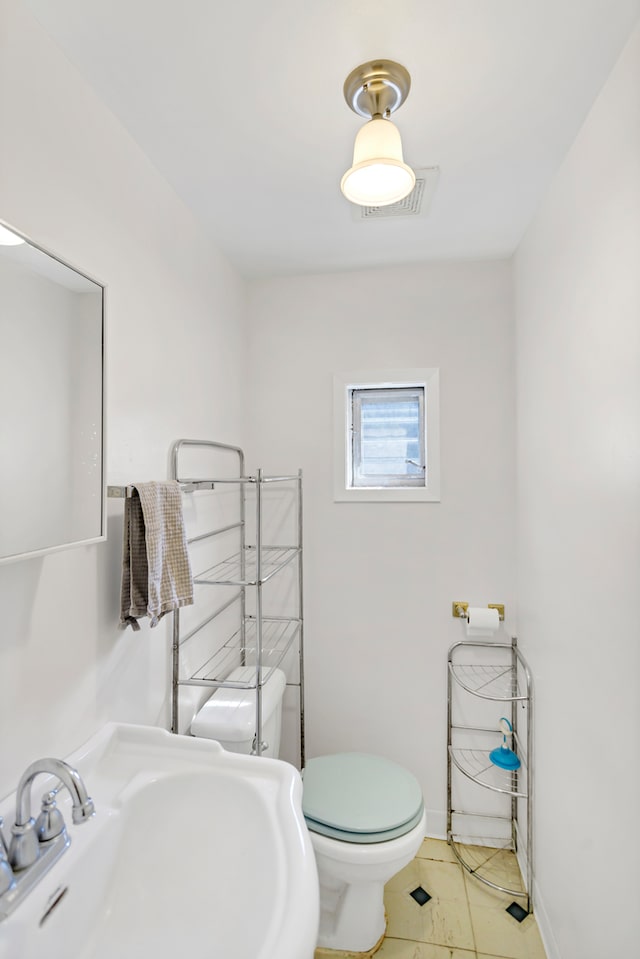 bathroom with toilet and sink