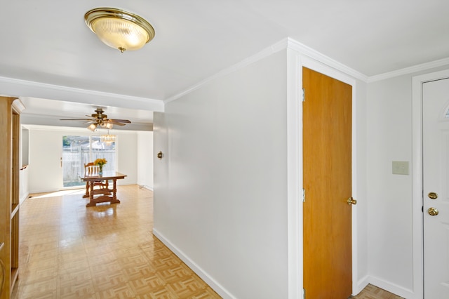 hall with light parquet flooring and ornamental molding