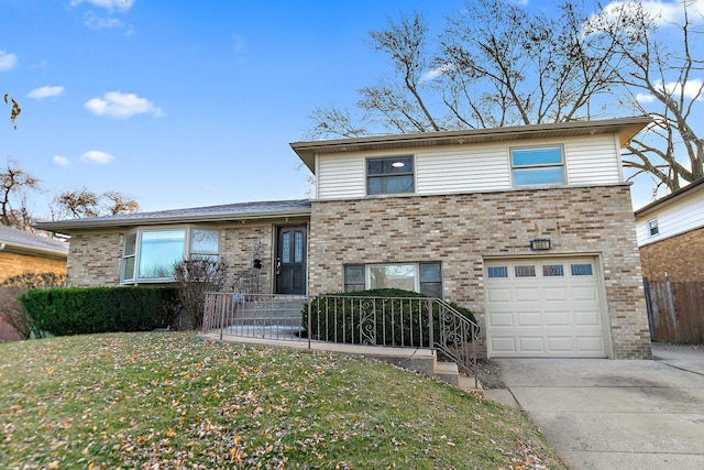 view of front of home featuring a garage and a front yard