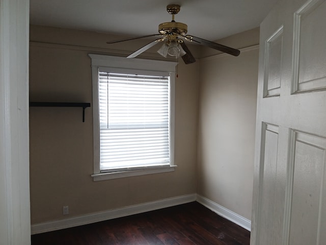 unfurnished room with ceiling fan and dark hardwood / wood-style floors