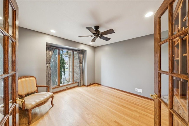 unfurnished room featuring wood-type flooring, french doors, and ceiling fan