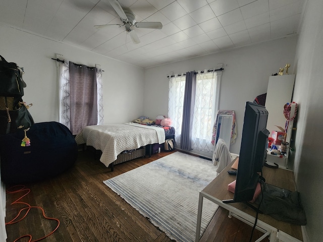 bedroom featuring ceiling fan and dark wood-type flooring