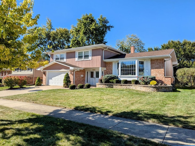 view of front of home with a garage and a front lawn