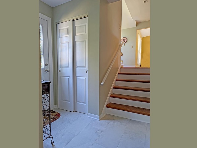 stairway with tile patterned flooring