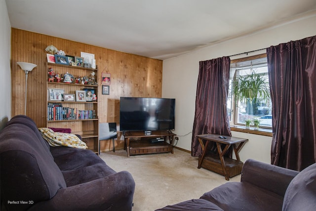 living room with light colored carpet and wood walls