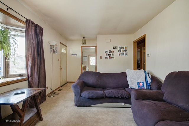 living room featuring light carpet