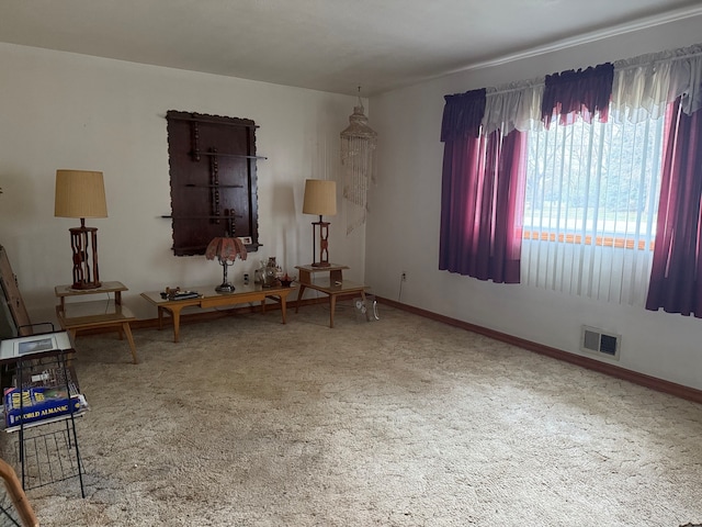 sitting room featuring carpet flooring