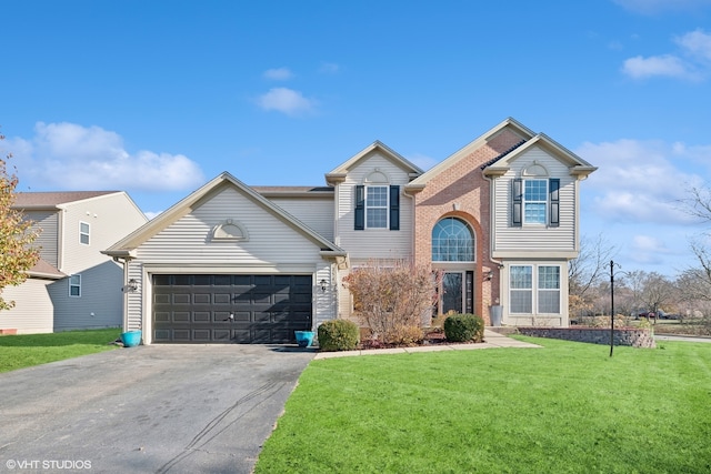 front of property featuring a front lawn and a garage