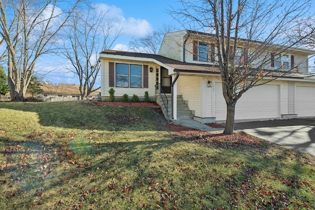 view of front facade featuring a front yard and a garage