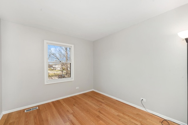 spare room featuring light hardwood / wood-style floors