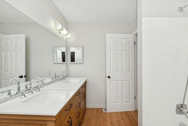 bathroom featuring hardwood / wood-style floors and vanity